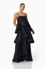 Brunette model wearing Tilly Tiered Maxi Dress in Black posed shot