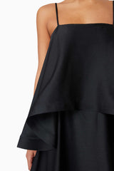 Brunette model wearing Tilly Tiered Maxi Dress in Black detail shot