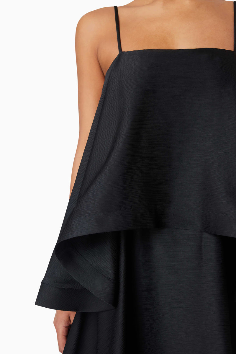Brunette model wearing Tilly Tiered Maxi Dress in Black detail shot