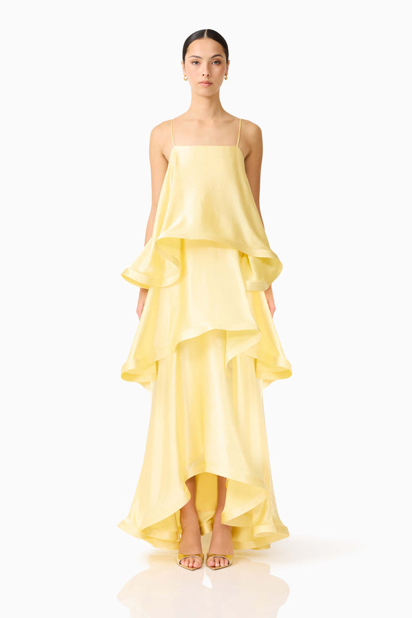 Brunette model wearing the Tilly Tiered Maxi Dress in Butter Yellow front shot 