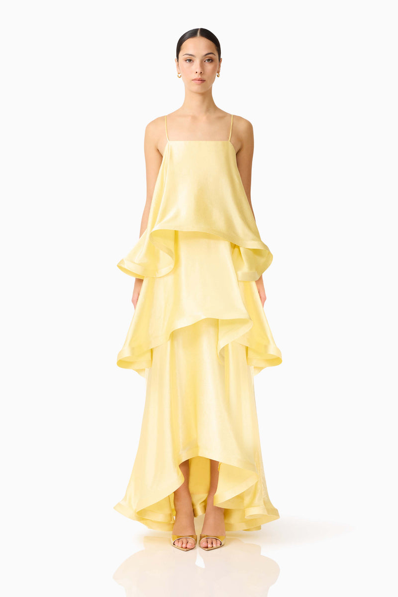 Brunette model wearing the Tilly Tiered Maxi Dress in Butter Yellow front shot