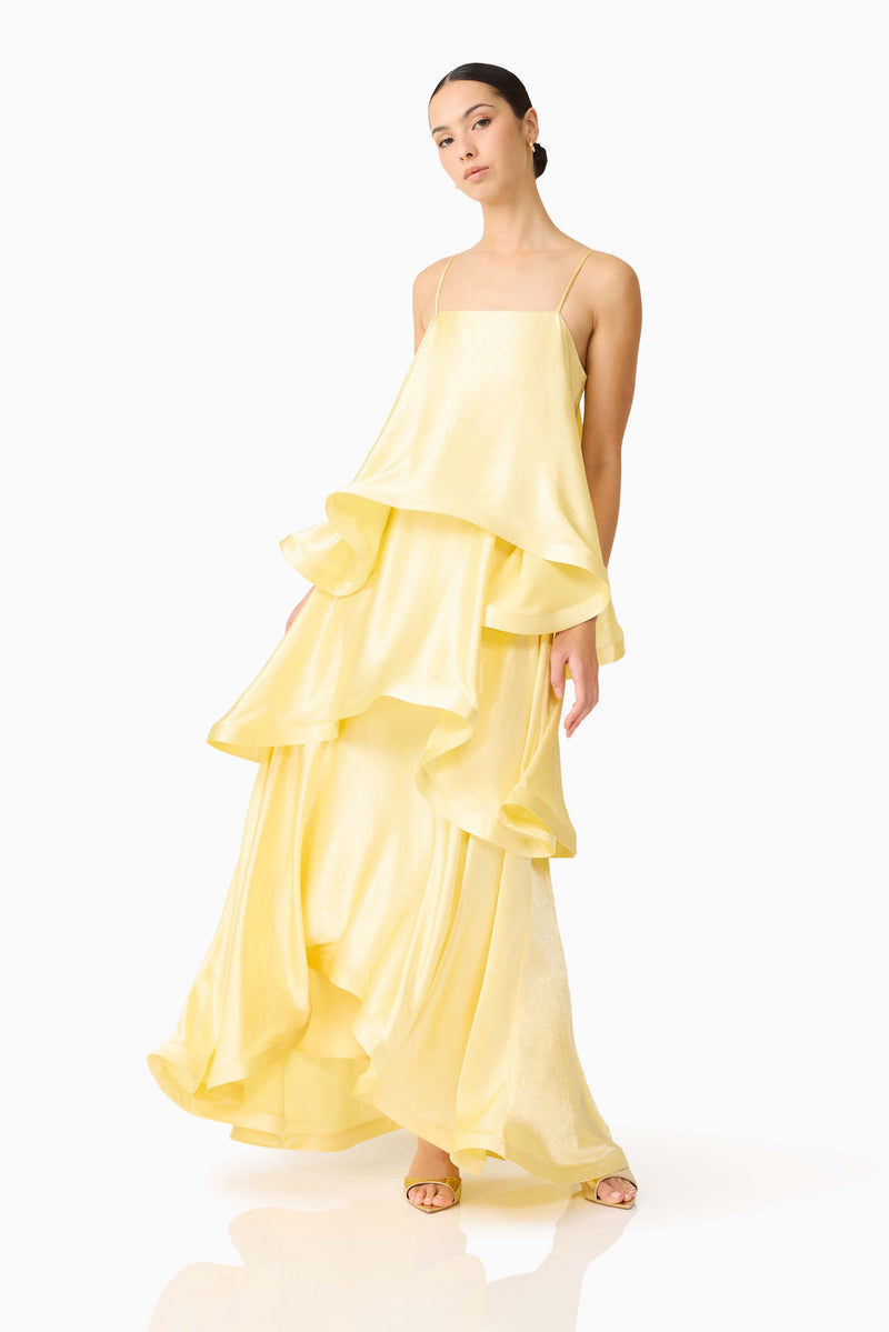 Brunette model wearing the Tilly Tiered Maxi Dress in Butter Yellow posed shot