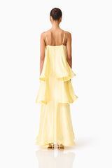Brunette model wearing Tilly Tiered Maxi Dress in Butter Yellow back shot