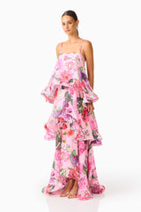 Brunette model wearing the Armani Tiered Maxi Dress in Pink Floral side shot