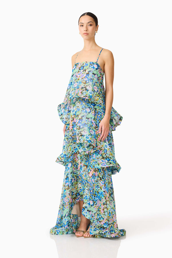 Brunette model wearing the Armani Tiered Maxi Dress In Blue Floral side shot