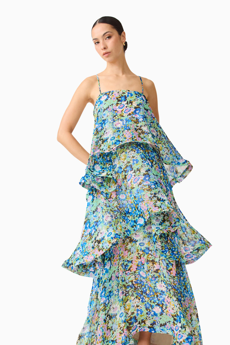 Brunette model wearing the Armani Tiered Maxi Dress In Blue Floral close up posed shot