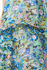Brunette model wearing the Armani Tiered Maxi Dress In Blue Floral detail shot