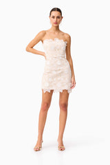 Brunette model wearing the Sienna Strapless Mini Dress in Cream posed shot