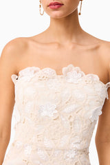 Brunette model wearing the Sienna Strapless Mini Dress in Cream detail shot