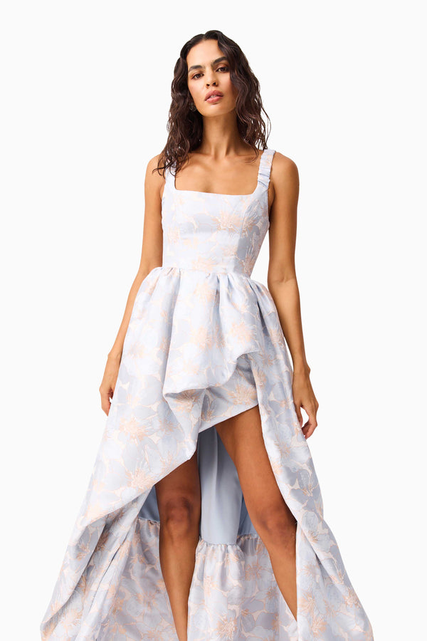 Brunette model wearing the Fiorella Jacquard Gown in Blue close up shot