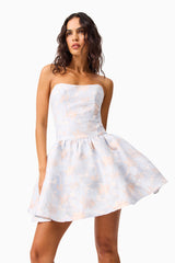 Brunette Model wearing the Fiorella Jacquard A-Line Mini Dress in Blue close up shot