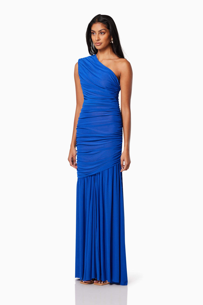 model wearing is VIENNA FITTED MAXI GOWN IN BLUE side shot