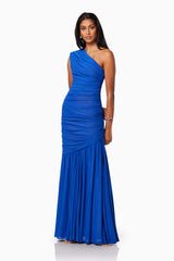 model wearing is VIENNA FITTED MAXI GOWN IN BLUE side shot