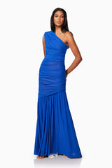 model wearing is VIENNA FITTED MAXI GOWN IN BLUE side shot