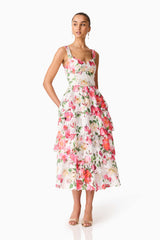 Brunette model wearing the Roselle Tiered Midi Dress Pink Floral posed shot