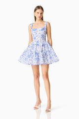 Brunette model wearing the Elin A-Line Mini Dress in Blue Floral posed front shot