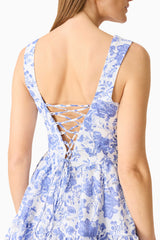 Brunette model wearing the Elin A-Line Mini Dress in Blue Floral detail shot