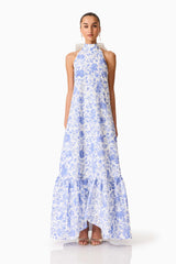 Brunette model wearing the Elin Halter Gown in Blue Floral front shot