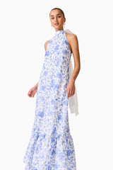 Brunette model wearing the Elin Halter Gown in Blue Floral close up shot