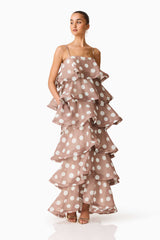 Brunette model wearing the Sola Tiered Maxi Dress in Brown Polkadot side shot