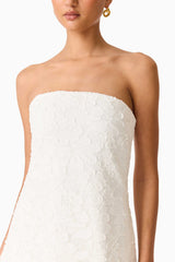 Brunette model wearing the Edelie Lace Mini Dress in White detail shot