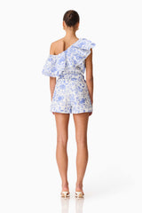 Brunette model wearing the Elin Top & Short Set in Blue Floral back shot