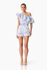 Brunette model wearing the Elin Top & Short Set in Blue Floral posed front shot