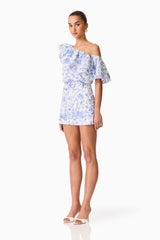 Brunette model wearing the Elin Top & Short Set in Blue Floral side shot
