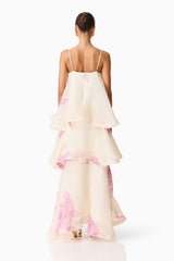 Brunette model wearing the Rova Tiered Gown in Cream & Pink Floral back shot