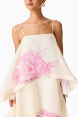 Brunette model wearing the Rova Tiered Gown in Cream & Pink Floral detail shot