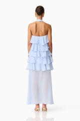 Brunette model wearing the Eliane Halter Neck Maxi Dress in Blue back shot 