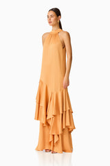 Varella Halter Gown in Orange with a frilled skirt side shot