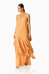 Varella Halter Gown in Orange with a frilled skirt posed shot