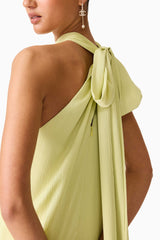 Brunette model wearing the Varella Halter Gown in Pistachio Green detail shot 