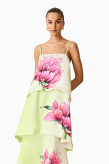 Brunette model wearing the Elisa Tiered Gown in Green & Pink Floral close up shot