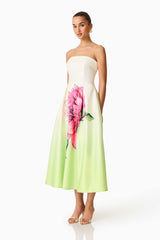 Brunette model wearing the Elisa Strapless Gown in Green & Pink Floral side shot