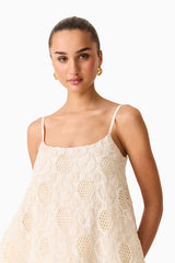 Brunette model wearing the Vessia Shift Mini Dress in White Detail Shot