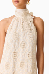 Brunette model wearing the Vessia Halter Neck Maxi Dress in Cream detail shot