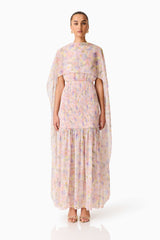 Brunette model wearing the Alinda Cape Gown in Pink Floral front shot