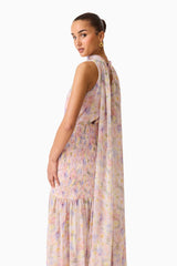 Brunette model wearing the Alinda Cape Gown in Pink Floral close up back shot