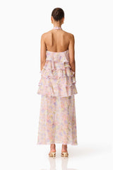 Brunette model wearing the Alinda Halter Neck Maxi Dress in Pink Floral back shot