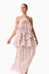 Brunette model wearing the Alinda Halter Neck Maxi Dress in Pink Floral posed side shot