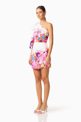 Brunette model wearing the Alice One Shoulder Mini Dress in Ombre Floral side shot 
