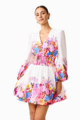 Brunette model wearing the Alice Long Sleeve Mini Dress in Ombre Floral posed close up shot 