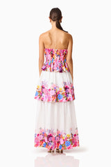 Brunette model wearing the Alice Tiered Gown in Ombre Floral back shot 