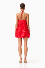 Brunette model wearing the Yvette Halter Mini Dress in Vermilion Red back shot 