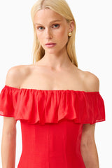 Brunette model wearing the Yvette Off Shoulder Gown in Vermilion Red close up shot 
