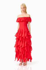 Brunette model wearing the Yvette Off Shoulder Gown in Vermilion Red side shot 