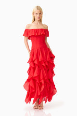 Brunette model wearing the Yvette Off Shoulder Gown in Vermilion Red posed shot 
