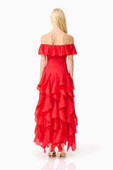 Brunette model wearing the Yvette Off Shoulder Gown in Vermilion Red back shot 